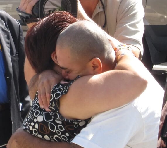Rafael Madrigal hugs his mother